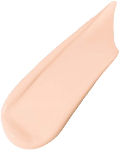 En ljus beige kräm är utbredd i en slät, kurvig form på en vit bakgrund.
