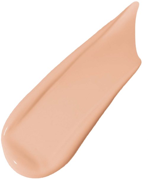 Ett beige eller hudfärgat flytande foundation-streck med spetsig ände.