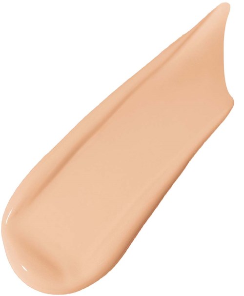 Ett beige-liknande flytande foundationprov med slät textur och en avsmalnande form.