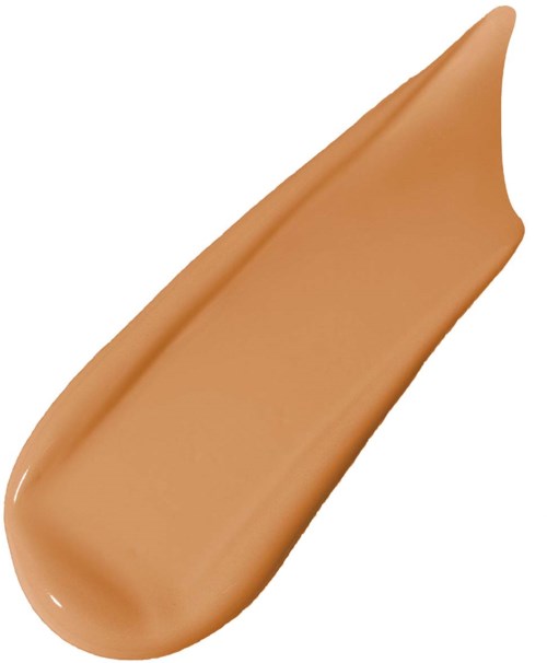 Ett beige sminkfundament som är utstruket med spetsig ände.