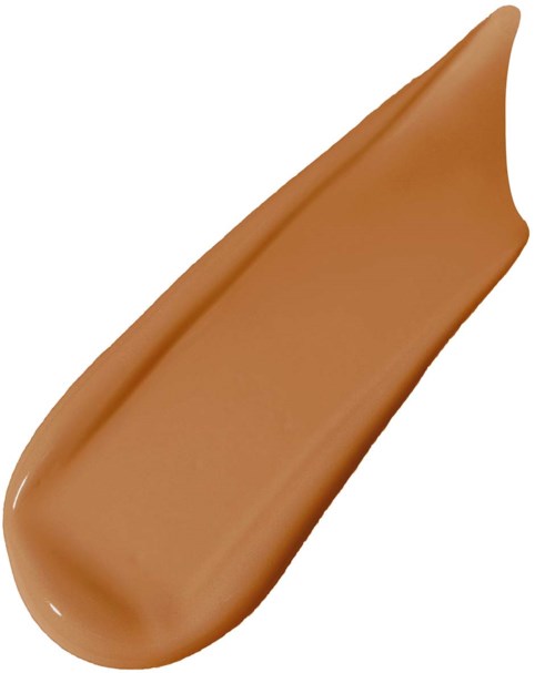 En beige/peachfärgad läppstift eller makeupprodukt med en kurvform.