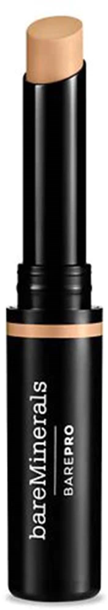 En beige makeup-stav i et svart rør merket 'bareMinerals BARE PRO'.