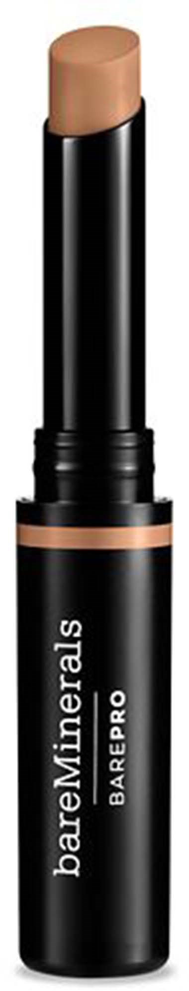 En beige makeupstift i et svart rør merket BareMinerals BarePRO. Coveret er fjernet, og produktet er synlig.