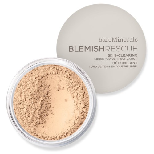 En rund behållare med löspuderfoundation med ett beige lock som visar varumärket BareMinerals och produktnamnet Blemish Rescue.