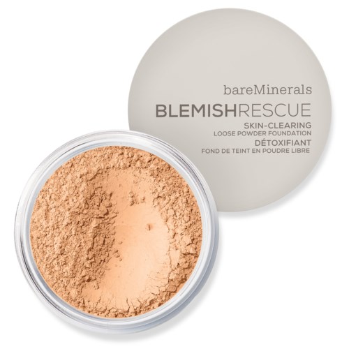 En rund behållare med beige löspuderfoundation, med lock märkt BareMinerals Blemish Rescue, hudrensande.