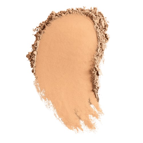 Beige puder spridd med ojämna kanter, ser ut som smink eller ansiktspuder. Vit bakgrund.