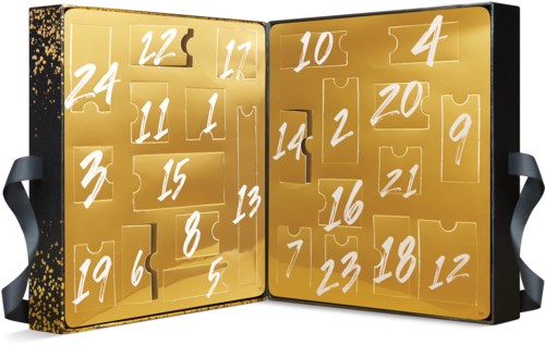 Ett gyllene adventskalender med numrerade fack, några öppna som visar choklad eller godsaker.