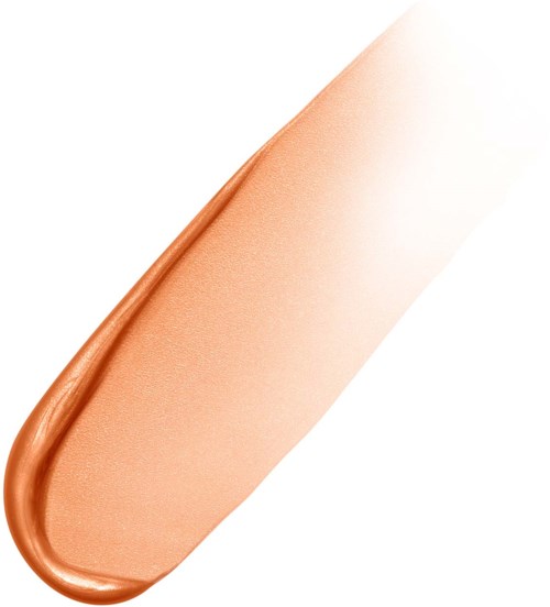 En beige sminke-svamp med en kobberfarget metallrull på den ene siden.