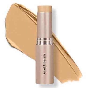 A beige stick with a cap, labeled 'bareMinerals', with a swatch of matching beige makeup behind it.