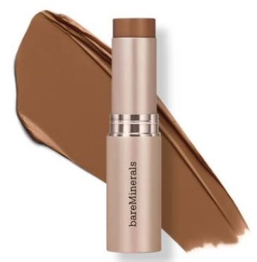 A beige stick of BareMinerals makeup with a background smear of chocolate-brown color.