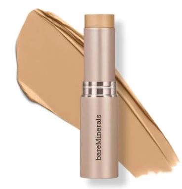 A beige stick of BareMinerals foundation with a swatch of the product spread out behind it.