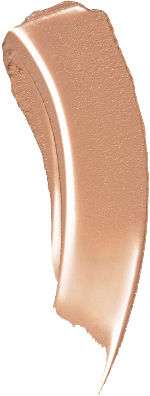 A curved beige makeup product, likely foundation or concealer, with a smooth texture and slightly lighter bottom.