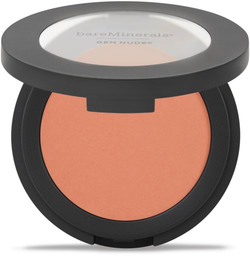 En rund makeup-compact med gråt låg og ferskenfarvet pudder indeni.