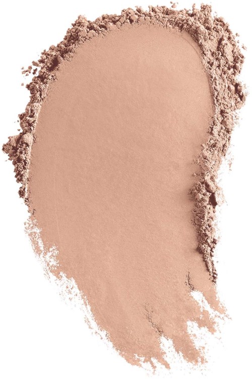 Ett beige, puderliknande makeup eller ansiktspuder utspritt i en ojämn tårform.