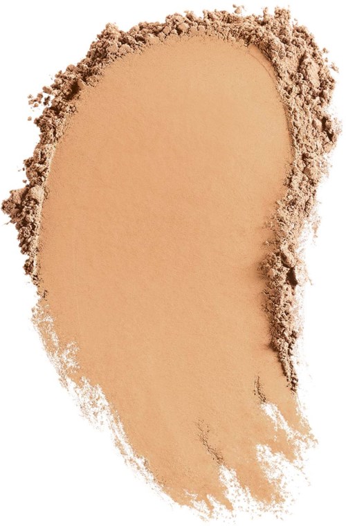 Ein beiges Make-up-Puder mit rauer Kante, auf weißem Hintergrund verteilt.