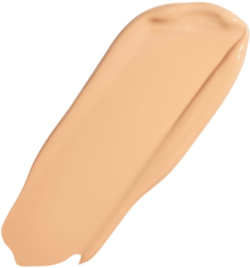 En beige flytande foundation provsudd spridd på vit bakgrund.