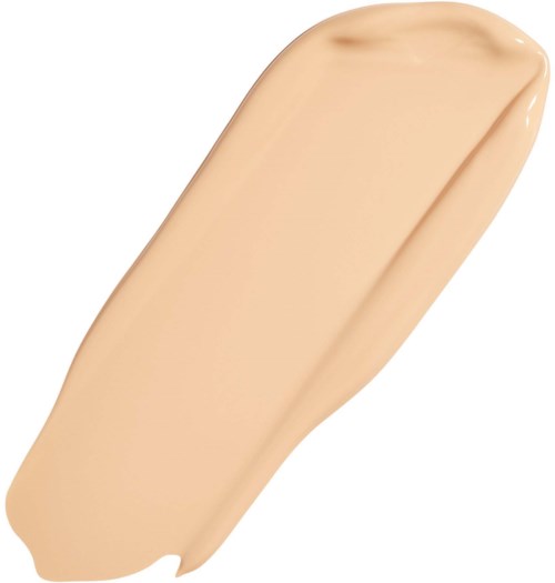 Beige nestemäinen meikkivoidesivu, jolla on sileä pinta ja kaareva muoto.