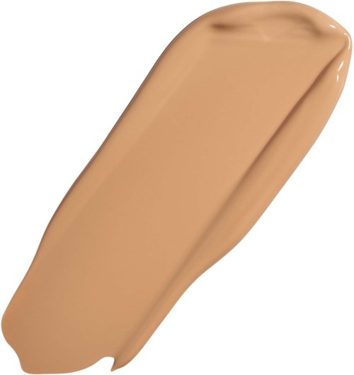Beige meikkivoide tai peitevoide, jolla on sileä ja kermaisen koostumuksen.