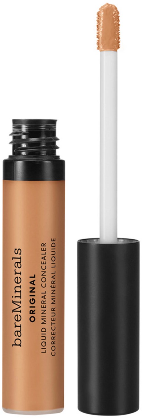 En beige flytande concealer i ett svart rör med en vit applikatorstift.