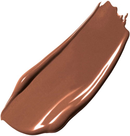 En slät, glänsande, brun chokladkaka med ett brutet kanter.