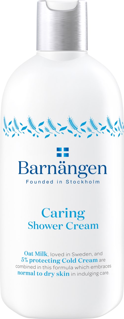 Vit flaska med blå text och design, märkt Barnängen Caring Shower Cream, främjar hudvård och fuktighet.