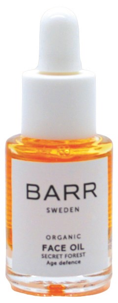 En liten glassflaske med oransje væske, merket 'BARR SWEDEN ORGANIC FACE OIL'. Den har en hvit pipetta.
