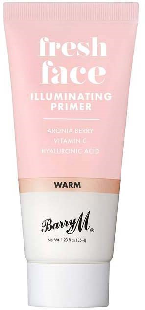 En rosa och vit tub med lysande primer, med ord och naturliga ingredienser på, märket Barry M.