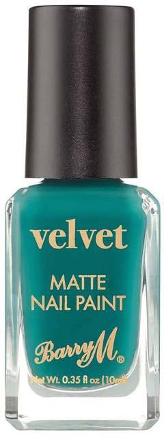En flaske med Barry M matte velvet neglelak i blågrøn farve med sort låg.