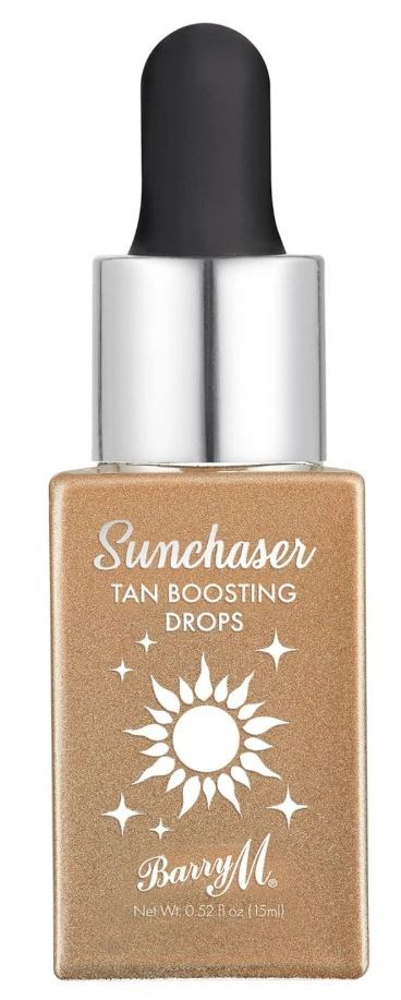 En flaska med brun-boostande droppar med pipett, märkt 'Suncatcher Tan Boosting Drops' och en sol, logotyp.