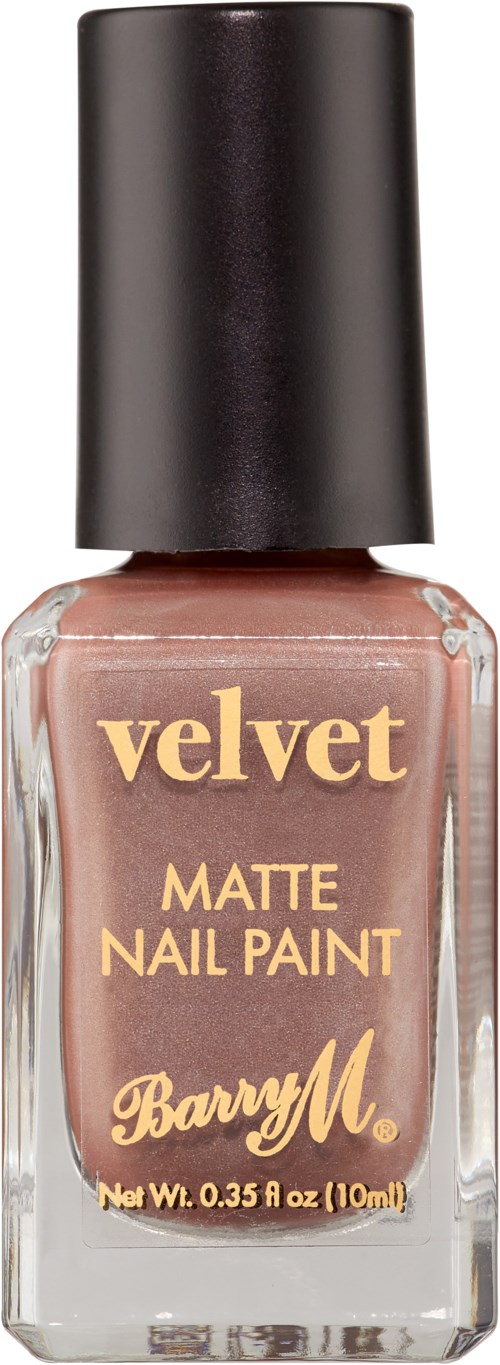 En flaska velvet matt nagellack med svart lock, beige färg och guldig text. Den är från Barry M.