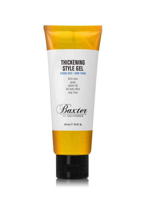 En gul och vit tub kräver stylinggel från Baxter med svart lock, med produktdetaljer på framsidan.