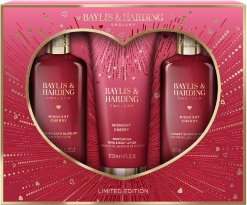 Pink packaging with bottles and tube inside, featuring hearts and gold accents, labeled 'Midnight Cherry' for bathing and moisturizing.