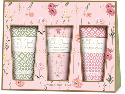 Facket innehåller tre lyxiga handbehandlingar med doft av ros, vallmo och vanilj, dekorerade med rosa och gröna blommor.