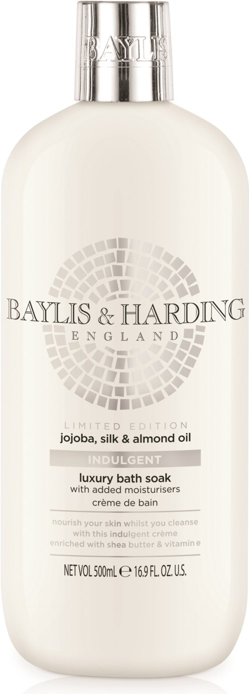 Hvit badebadsflaske med sølvhett, merket med merke, duft og beskrivelse av ingredienser og formål.