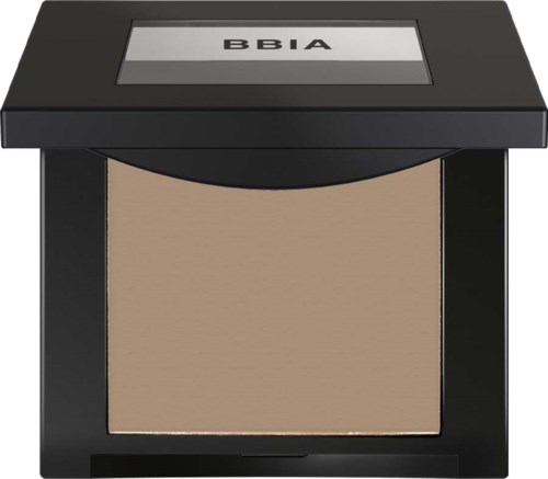 En makeupprodukt med en spegel ovanpå och ett beige puder inuti.