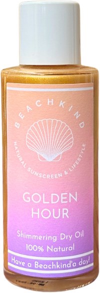 A small bottle of beach-themed sunscreen with a pink and purple label stating 'Golden Hour Shimmering Dry Oil' and 'Have a Beachkind day.'