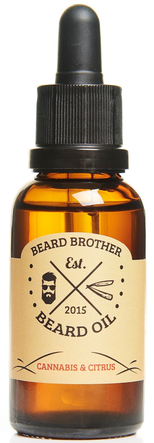 Bärnstensfärgat glasflaska med svart droppe, märkt 'Beard Oil' med cannabis och citrus doft.