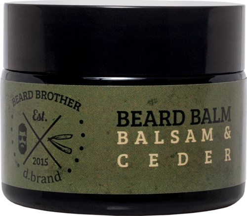 En liten mörk burk märkt 'Beard Balm Balsam & Cedar' med gröna och svarta färger och en logo.
