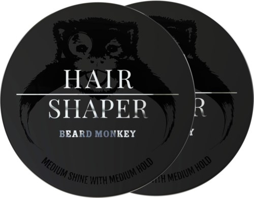 Een zwart cirkelvormig logo met een aap gezicht, tekst over haarstijl, baard en hold, en details over glans en houdbaarheid.