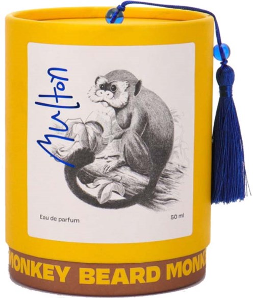 En gul parfymbehållare med illustration av en apa och texten 'Monkey Beard Mon'.
