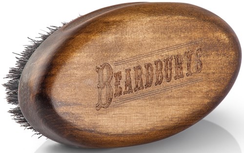 A wooden beard brush with dark bristles and the word 'BEARDUBES' engraved on it.