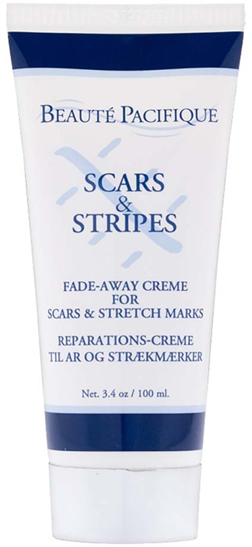 Tub med krem for arr og strekkmerker med blå og hvit design, merket 'Beauté Pacifique' og 'Scars & Stripes.'