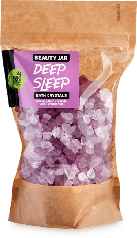 Ett badkristallprodukt som heter 'Deep Sleep' i ett brunt och lila paket med ett genomskinligt fönster.
