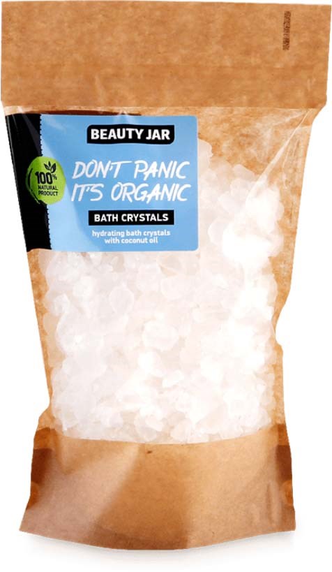 En brun papirpose inneholder hvite badekrystaller, med en blå etikett som sier "Don't Panic, It's Organic."