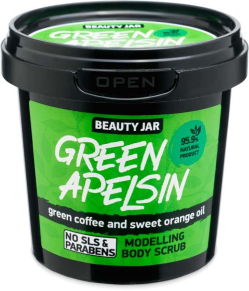 Black container with green label for body scrub with orange and coffee oil, no parabens or SLS, natural product.