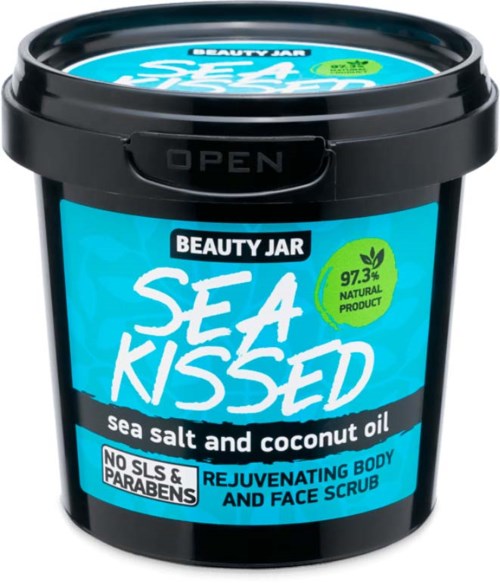 A black container with a blue label, showing the product name Sea Kissed, sea salt, and coconut oil. Open lid.