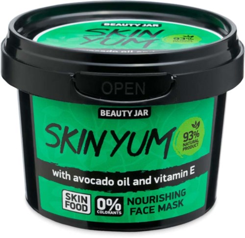 A black jar labeled 'SKINYUM' contains a nourishing face mask with avocado oil, vitamin E, natural ingredients, and no colorants.