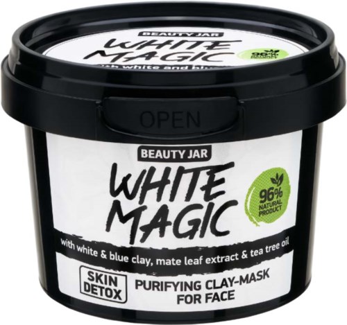 Musta rasia kasvojenpuhdistusnaamiolle nimeltä White Magic, sisältää luonnollisia aineita kuten savea ja teepuuöljyä.
