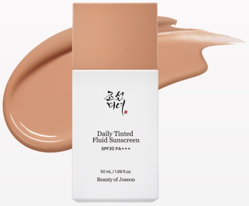 A white bottle with black Korean text, tan lid, and tan sunscreen spilled behind it.