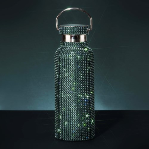 A water bottle decorated with shiny, sparkling rhinestones, standing against a dark background.